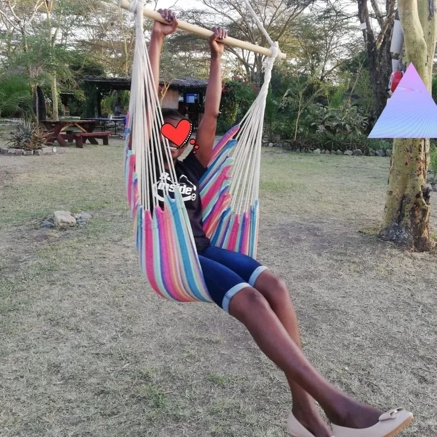 Portable outdoor Hammock with cushions and wooden bar...High density of knitting for cosy feeling and lasting life...Has two cushions and 34inches wide seat and capacity of 200Kgs and size of 130cmx10