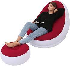 Inflatable seat, with foot rest and a manual pump