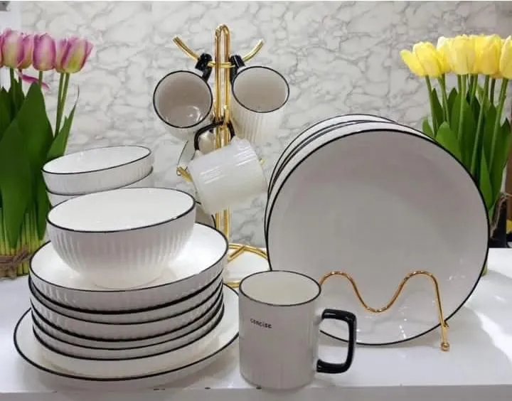12 Piece Black Rimmed Ceramic Dining Set – Limited Stock! Elevate your dining experience with stylish 8” plates & cups – perfect for family meals & elegant hosting.