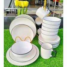 12 Piece Black Rimmed Ceramic Dining Set – Limited Stock! Elevate your dining experience with stylish 8” plates & cups – perfect for family meals & elegant hosting.