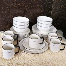 12 Piece Black Rimmed Ceramic Dining Set – Limited Stock! Elevate your dining experience with stylish 8” plates & cups – perfect for family meals & elegant hosting.