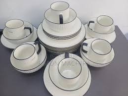12 Piece Black Rimmed Ceramic Dining Set – Limited Stock! Elevate your dining experience with stylish 8” plates & cups – perfect for family meals & elegant hosting.