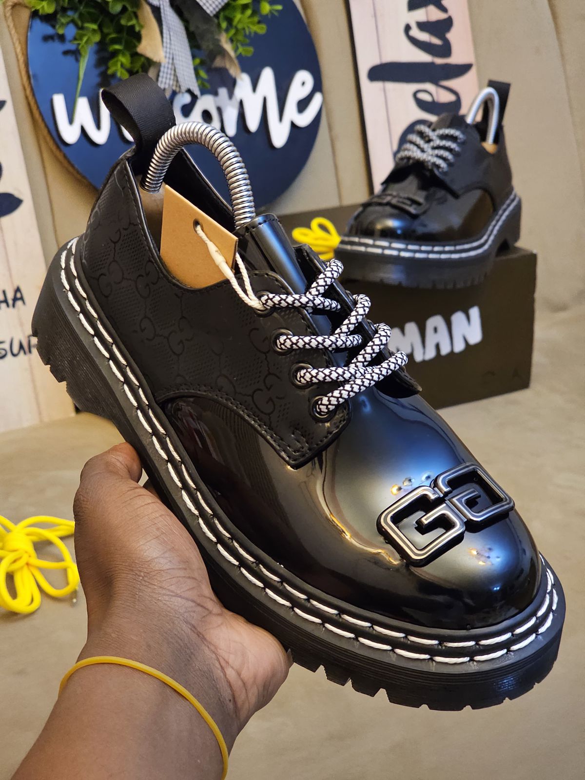 🔥 Original Leather Dr Marten black patent leather-style lace-up shoes with a thick, (Dr Martin)lugged sole and a metallic embellishment on the vamp.  very comfortable and classy official cassual loe
