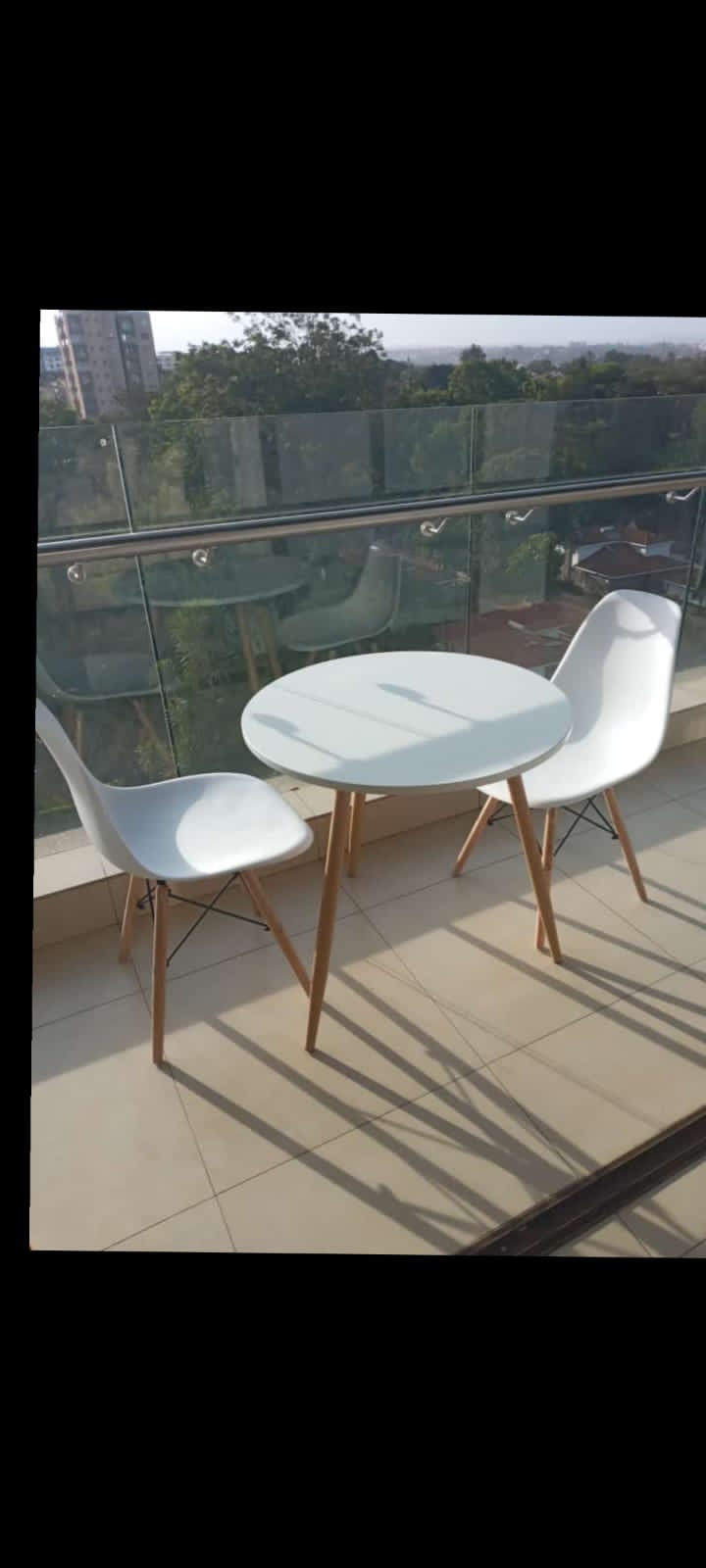 Two seater minimalist modern dining. Two strong chairs enhanced with metal rods One table size 60×60×70cm Metal stands