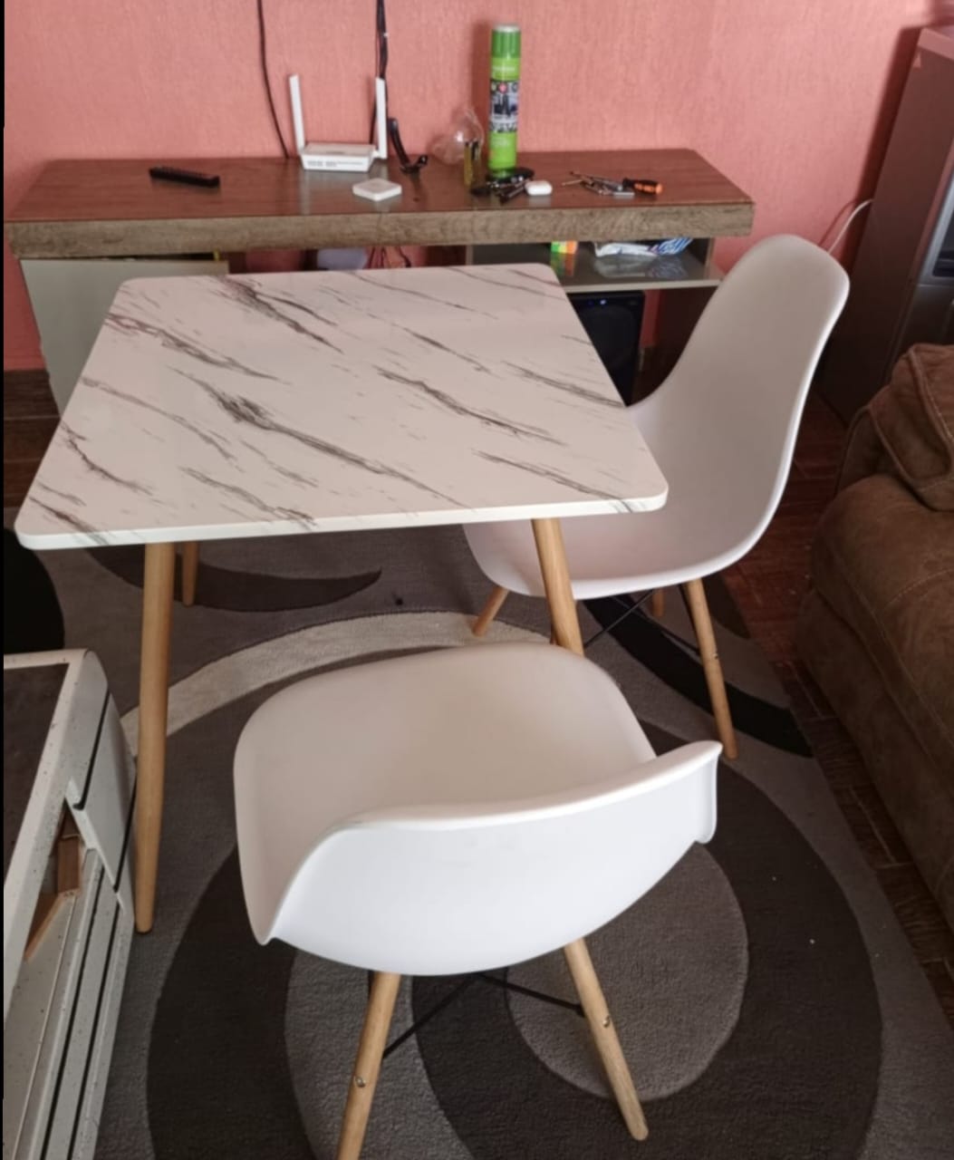Two seater minimalist modern dining. Two strong chairs enhanced with metal rods One table size 60×60×70cm Metal stands