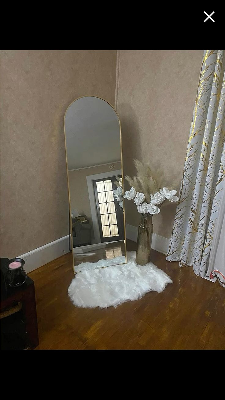 ✅️AVAILABLE AT THE SHOP✅️Free Standing Dressing Mirror With Wheels.Elevate your home decor and personal style with this elegant full-length standing mirror. Featuring a sleek, arched design and a stur