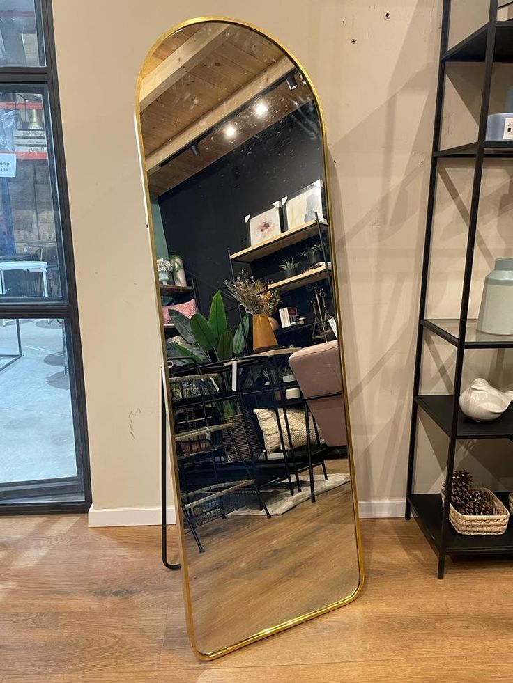 ✅️AVAILABLE AT THE SHOP✅️Free Standing Dressing Mirror With Wheels.Elevate your home decor and personal style with this elegant full-length standing mirror. Featuring a sleek, arched design and a stur