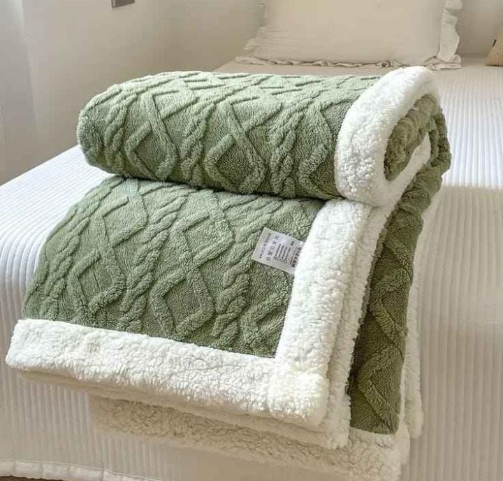 Cozy fleece woolen blanket. Crafted with high-quality, thickened fabric, this blanket provides exceptional insulation and plush comfort. Stay warm and cozy during chilly nights or relaxing moments.