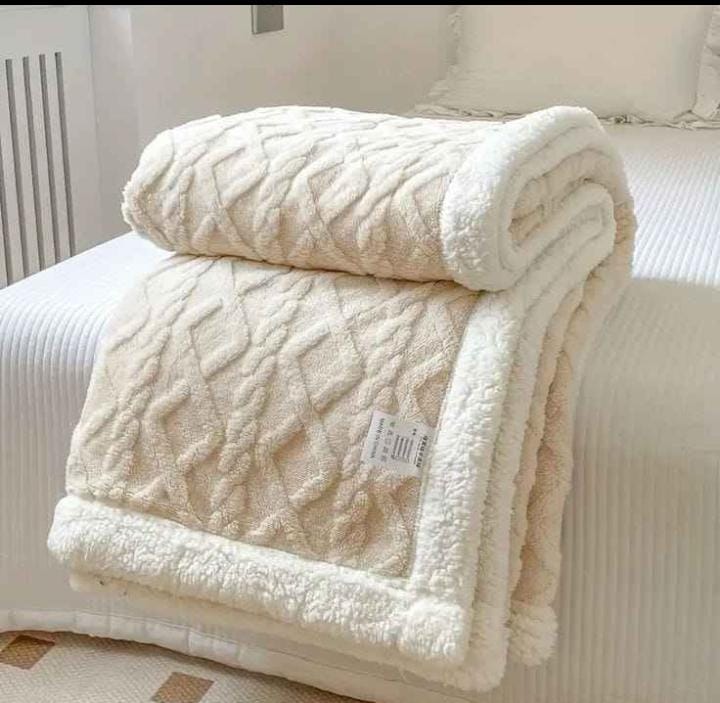 Cozy fleece woolen blanket. Crafted with high-quality, thickened fabric, this blanket provides exceptional insulation and plush comfort. Stay warm and cozy during chilly nights or relaxing moments.