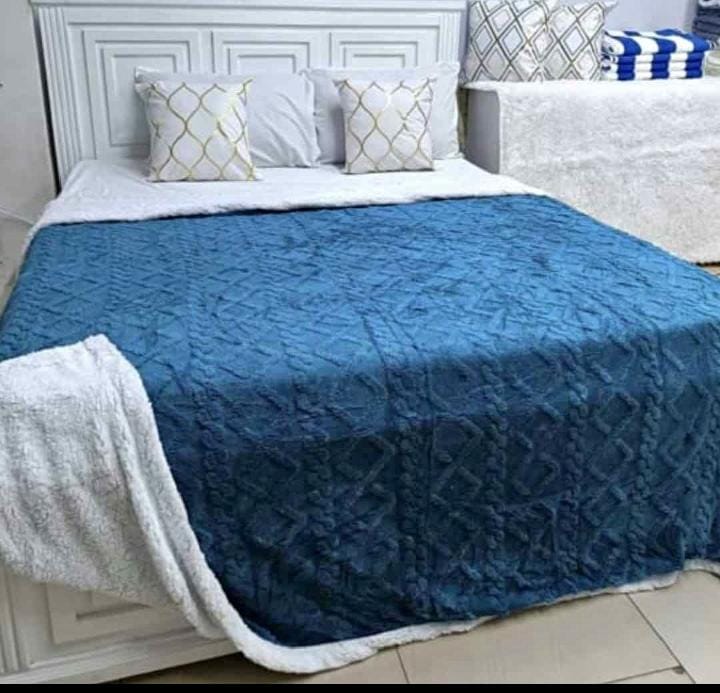 Cozy fleece woolen blanket. Crafted with high-quality, thickened fabric, this blanket provides exceptional insulation and plush comfort. Stay warm and cozy during chilly nights or relaxing moments.