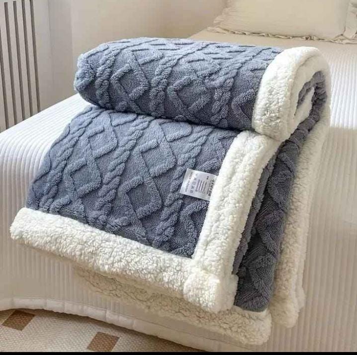 Cozy fleece woolen blanket. Crafted with high-quality, thickened fabric, this blanket provides exceptional insulation and plush comfort. Stay warm and cozy during chilly nights or relaxing moments.