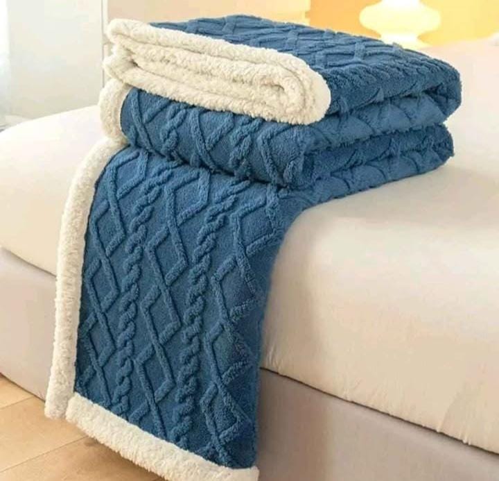 Cozy fleece woolen blanket. Crafted with high-quality, thickened fabric, this blanket provides exceptional insulation and plush comfort. Stay warm and cozy during chilly nights or relaxing moments.