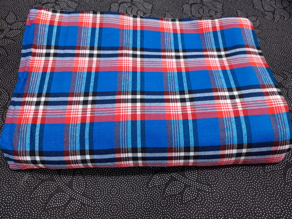 Masai Shuka.Crafted from high-quality cotton or acrylic blends, this blanket is designed to be both warm and breathable, making it ideal for outdoor adventures.