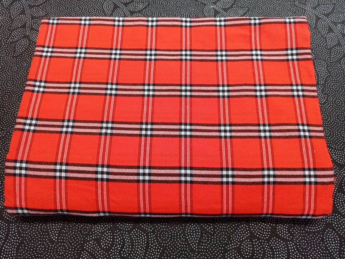 Masai Shuka.Crafted from high-quality cotton or acrylic blends, this blanket is designed to be both warm and breathable, making it ideal for outdoor adventures.