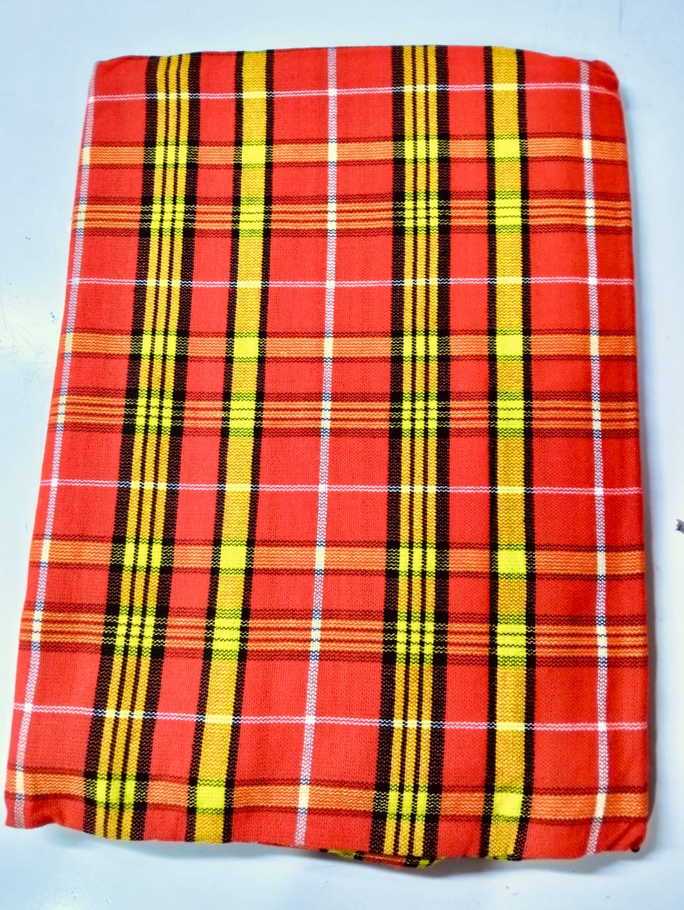 Masai Shuka.Crafted from high-quality cotton or acrylic blends, this blanket is designed to be both warm and breathable, making it ideal for outdoor adventures.