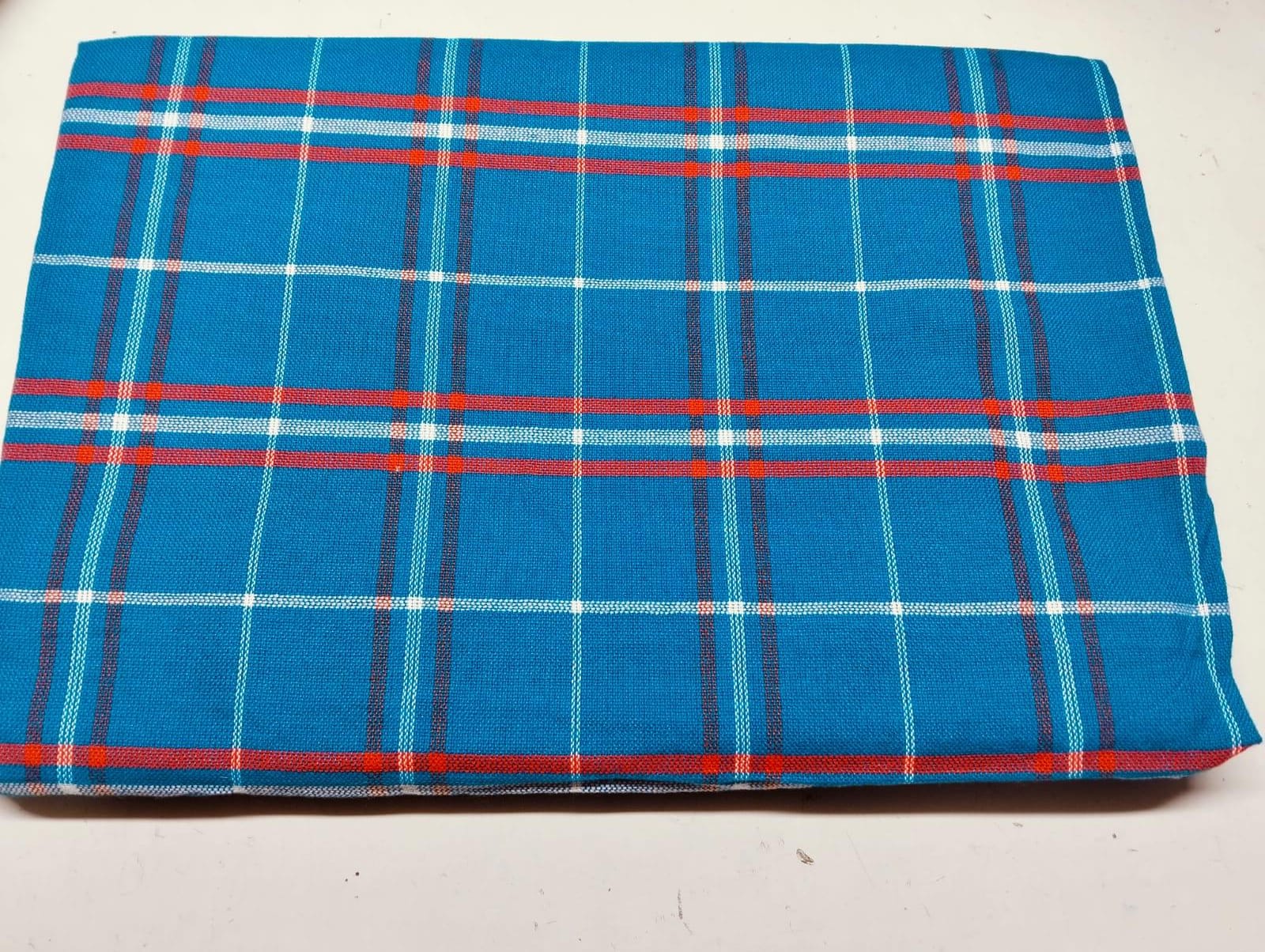 Masai Shuka.Crafted from high-quality cotton or acrylic blends, this blanket is designed to be both warm and breathable, making it ideal for outdoor adventures.