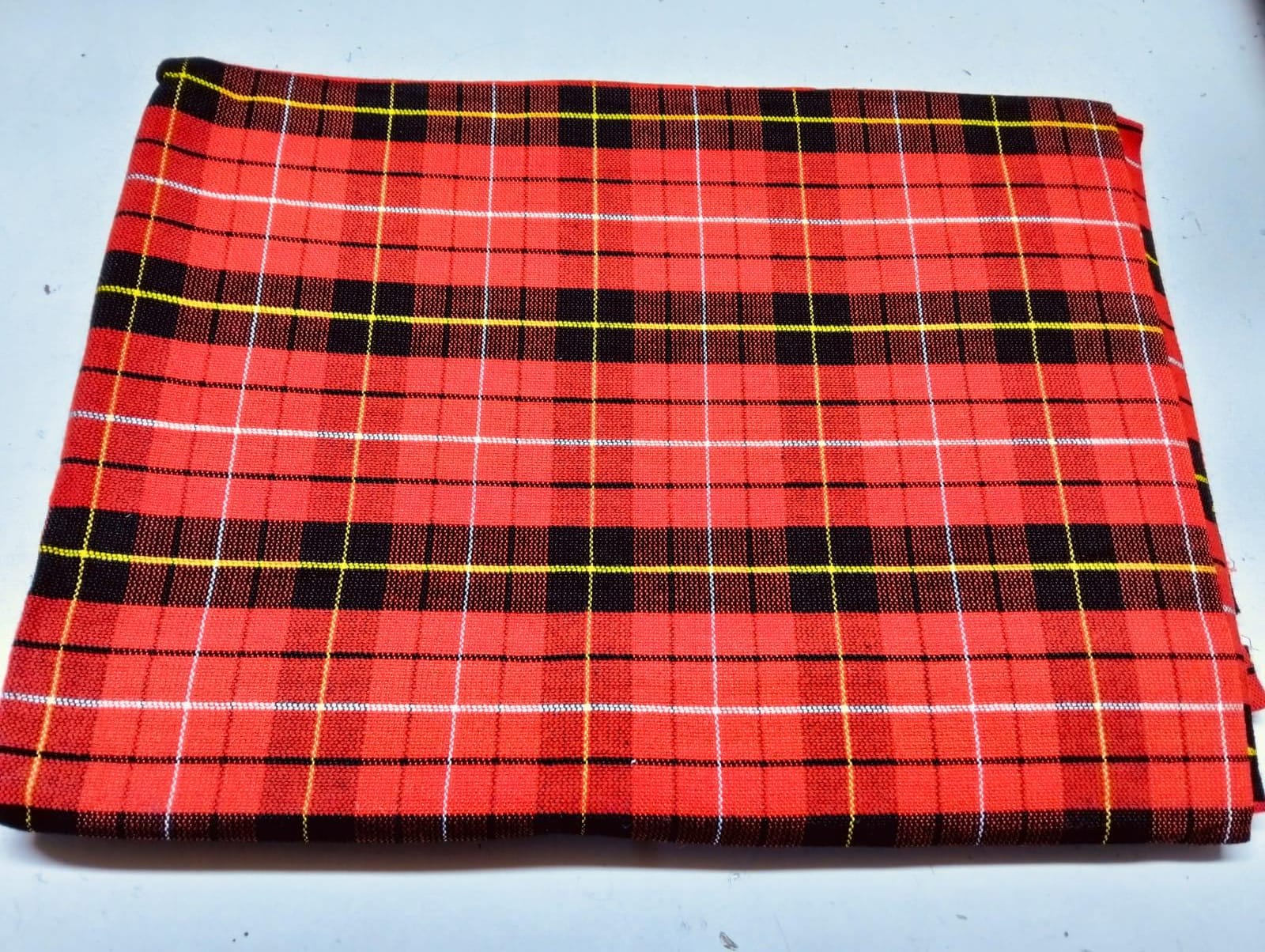 Masai Shuka.Crafted from high-quality cotton or acrylic blends, this blanket is designed to be both warm and breathable, making it ideal for outdoor adventures.