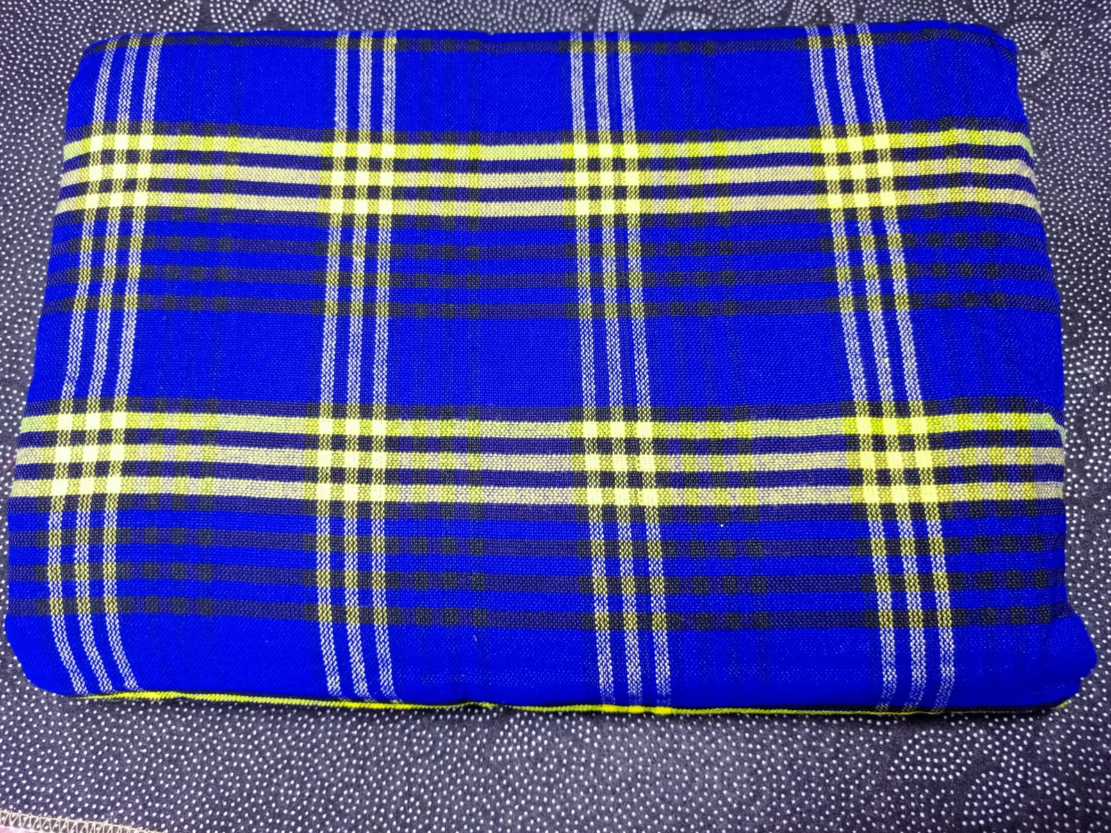 Masai Shuka.Crafted from high-quality cotton or acrylic blends, this blanket is designed to be both warm and breathable, making it ideal for outdoor adventures.