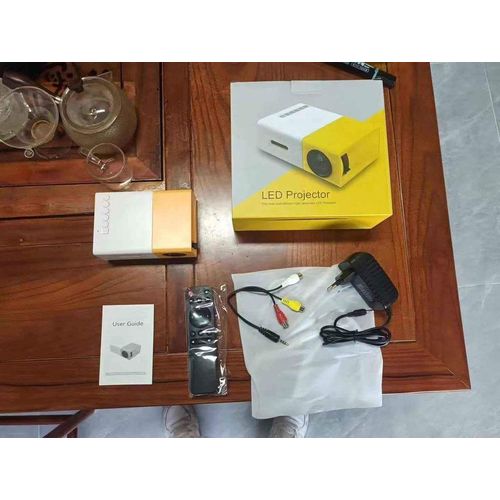 YG300 New small projector home portable high-definition projector, plug-in connection with the phone's built-in audio