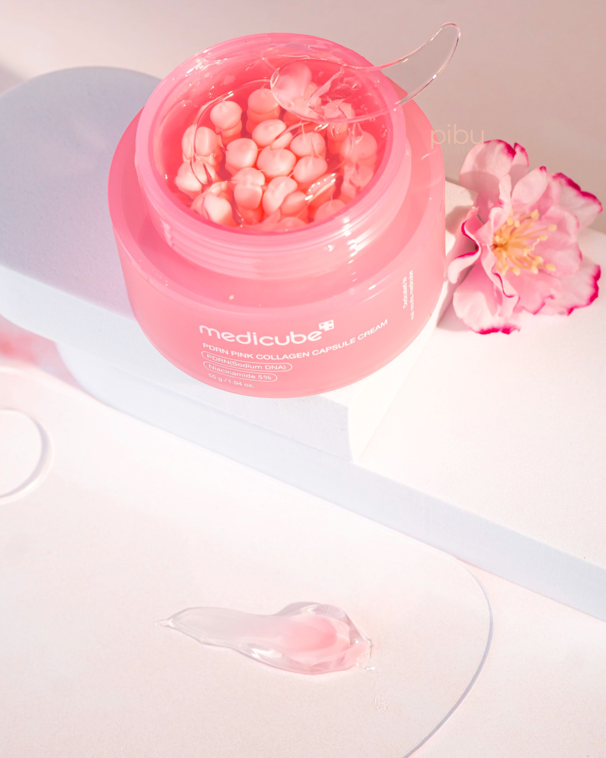 Medicube PDRN Pink Collagen Capsule Cream, containing collagen, niacinamide, and hyaluronic acid, designed to firm, brighten, hydrate, and strengthen the skin barrier for a radiant, "glass-skin" glow