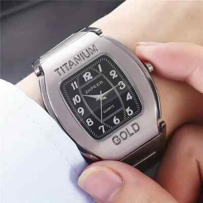 Men Quartz Wrist Watch Big Square Chronograph Titanium Gold For Business Leisure.The watch is constructed with a robust titanium alloy case and an alloy strap. The dial window is made of ordinaryglass