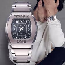 Men Quartz Wrist Watch Big Square Chronograph Titanium Gold For Business Leisure.The watch is constructed with a robust titanium alloy case and an alloy strap. The dial window is made of ordinaryglass