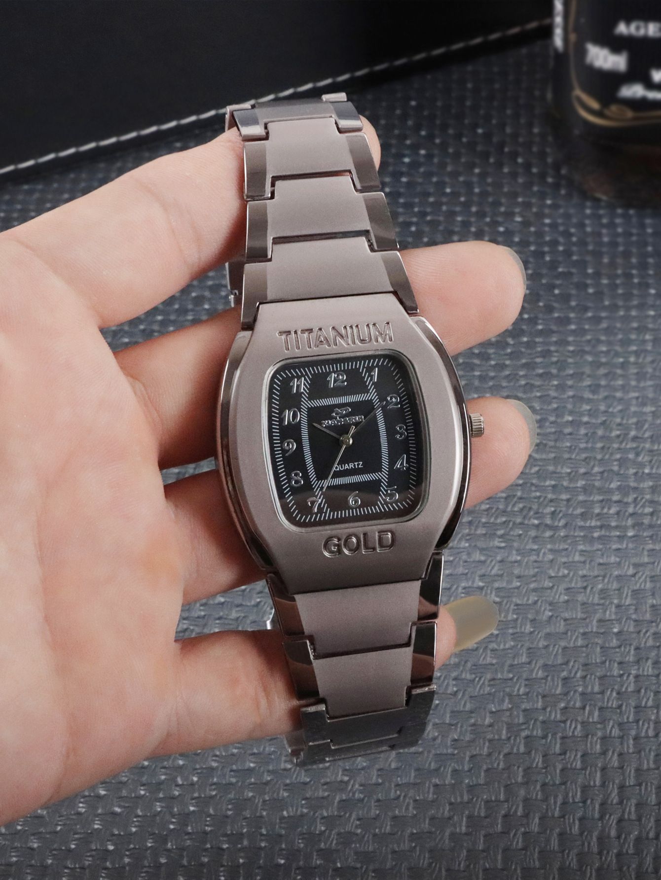Men Quartz Wrist Watch Big Square Chronograph Titanium Gold For Business Leisure.The watch is constructed with a robust titanium alloy case and an alloy strap. The dial window is made of ordinaryglass
