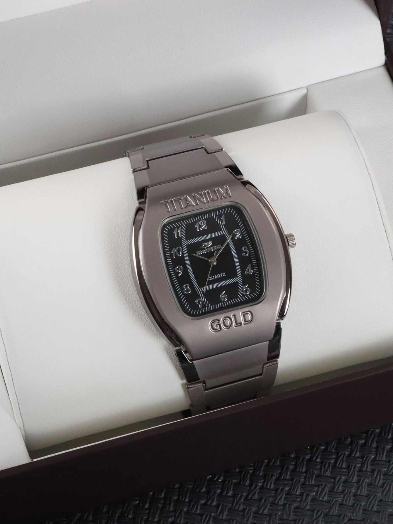 Men Quartz Wrist Watch Big Square Chronograph Titanium Gold For Business Leisure.The watch is constructed with a robust titanium alloy case and an alloy strap. The dial window is made of ordinaryglass
