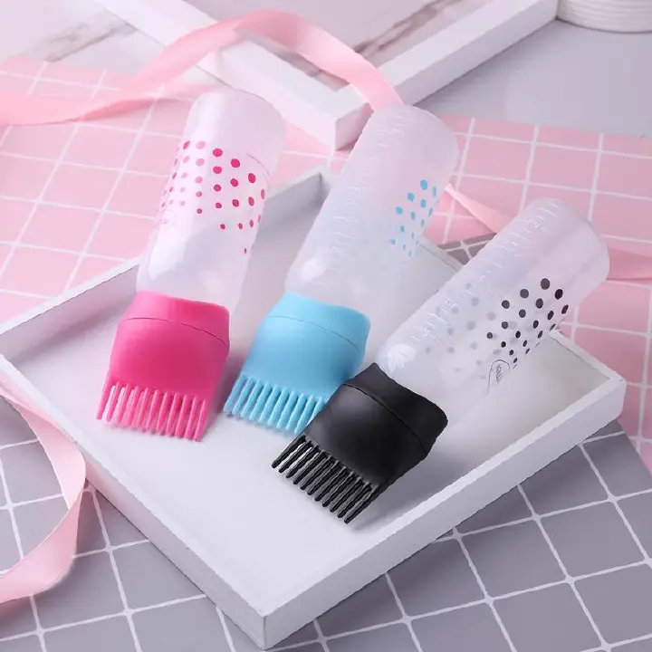 Hair Dye Applicator Bottle Oil Dispenser Brush Comb Shampoo Bottle.A squeeze bottle equipped with a comb-shaped applicator tip for simultaneous dispensing and combing.Approximately 170mm in height.