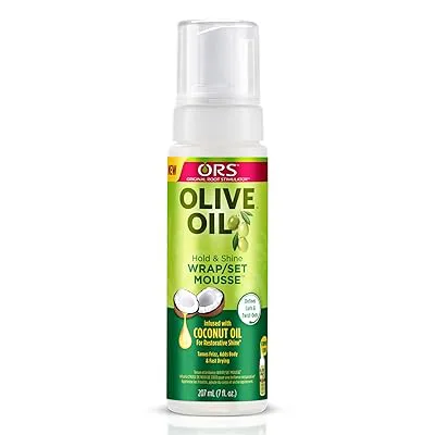 Olive Oil Ors Olive Oil Hold & Shine Wrap/Set Mousse - 207ml combines the power of nourishing Olive Oil and restorative Coconut Oil to moisturize and enhance shine while delivering incredible hold.