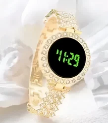 Ladies LED Watch paired with coordinating stackable bracelets.a watch comes as  set with multiple stackable bracelets, often including heart shaped charms or leaf motifs gold-tone watch with a crystal