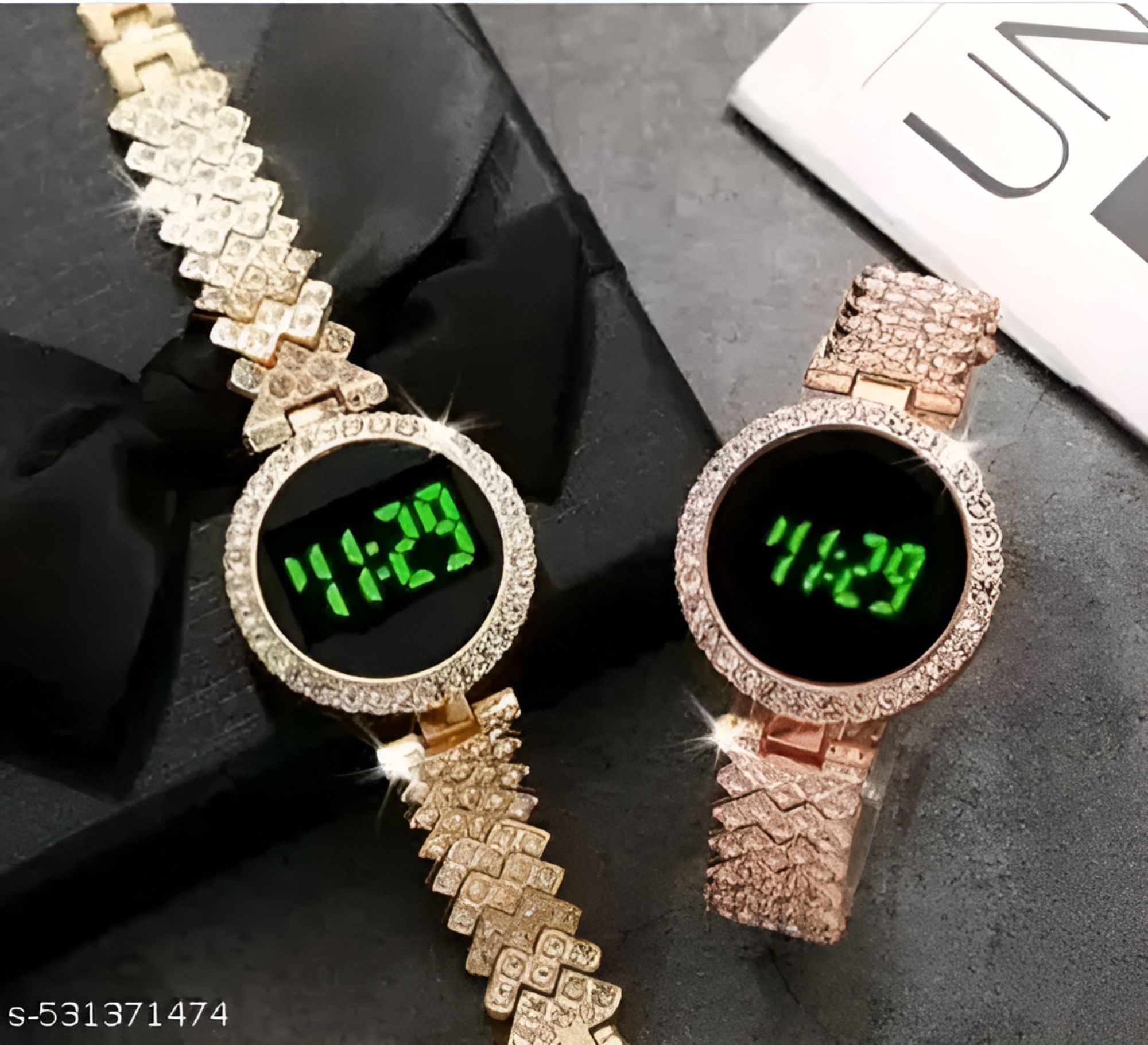 Ladies LED Watch paired with coordinating stackable bracelets.a watch comes as  set with multiple stackable bracelets, often including heart shaped charms or leaf motifs gold-tone watch with a crystal