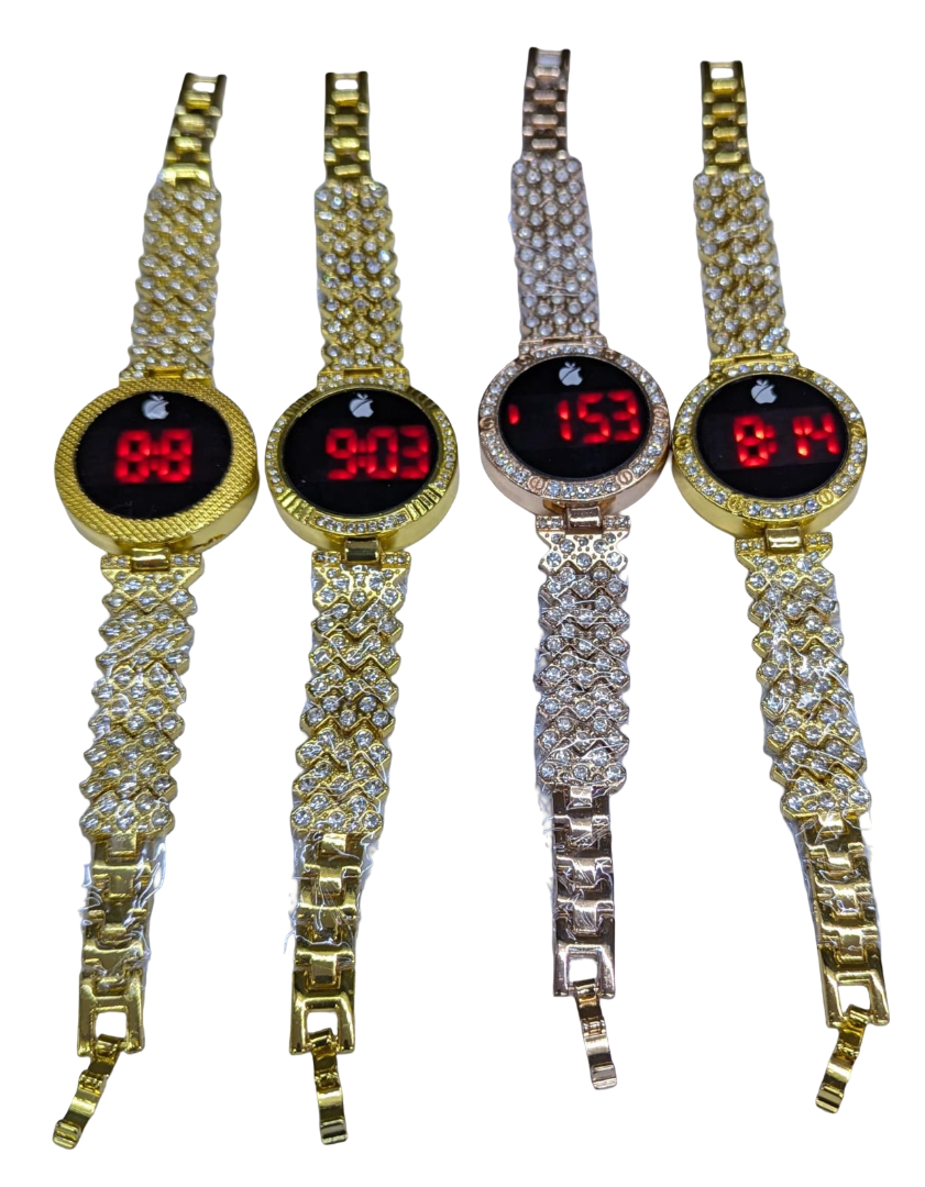 Ladies LED Watch paired with coordinating stackable bracelets.a watch comes as  set with multiple stackable bracelets, often including heart shaped charms or leaf motifs gold-tone watch with a crystal