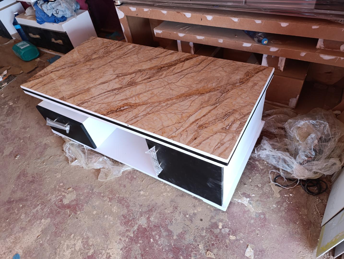 New design coffee table with brown or black top size 4x2  for your living room.