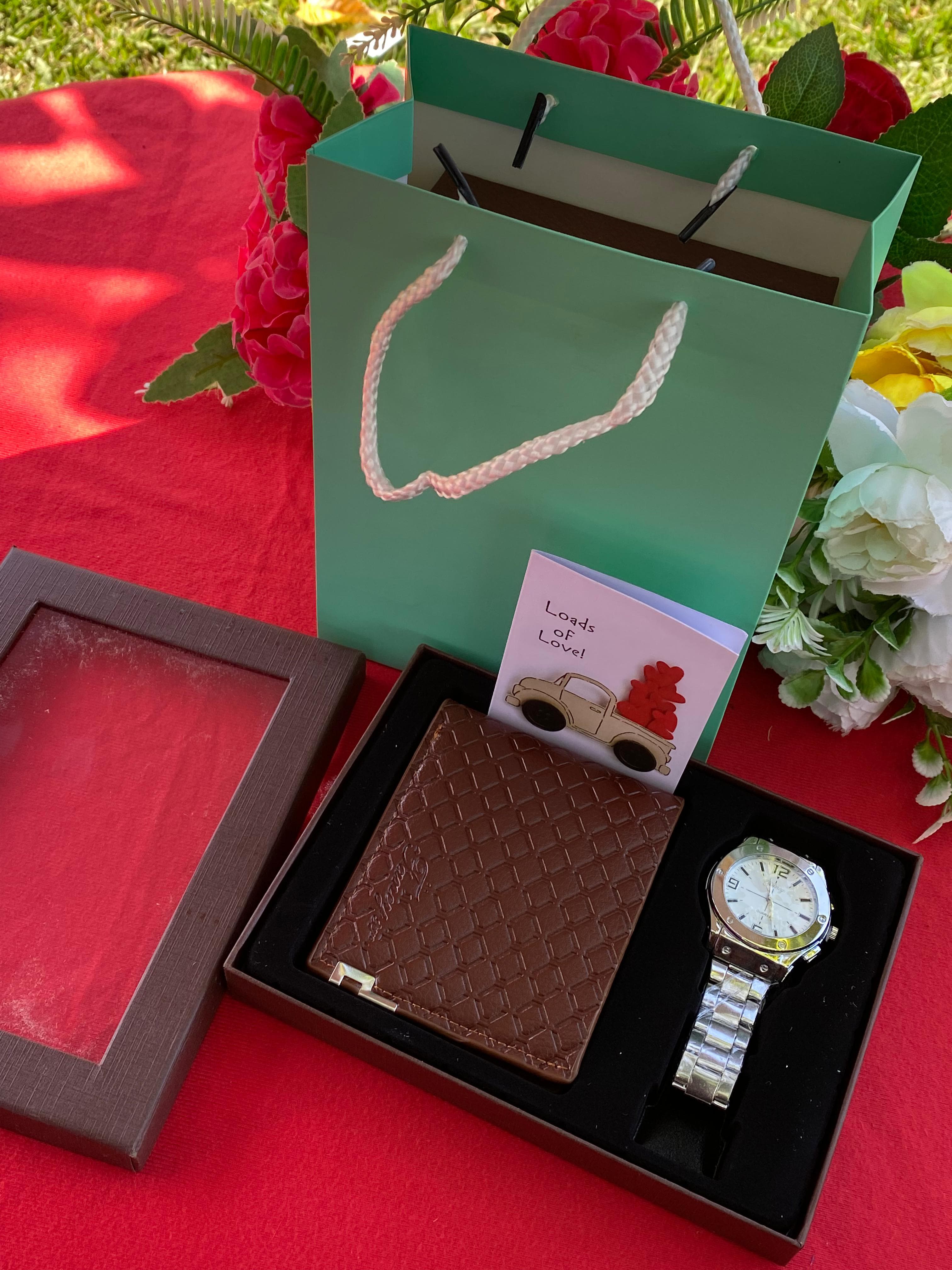 (NEW CLASSY ARRIVAL)Mens modest valentines gift set.Comprises of a watch a card a bag and a wallet.