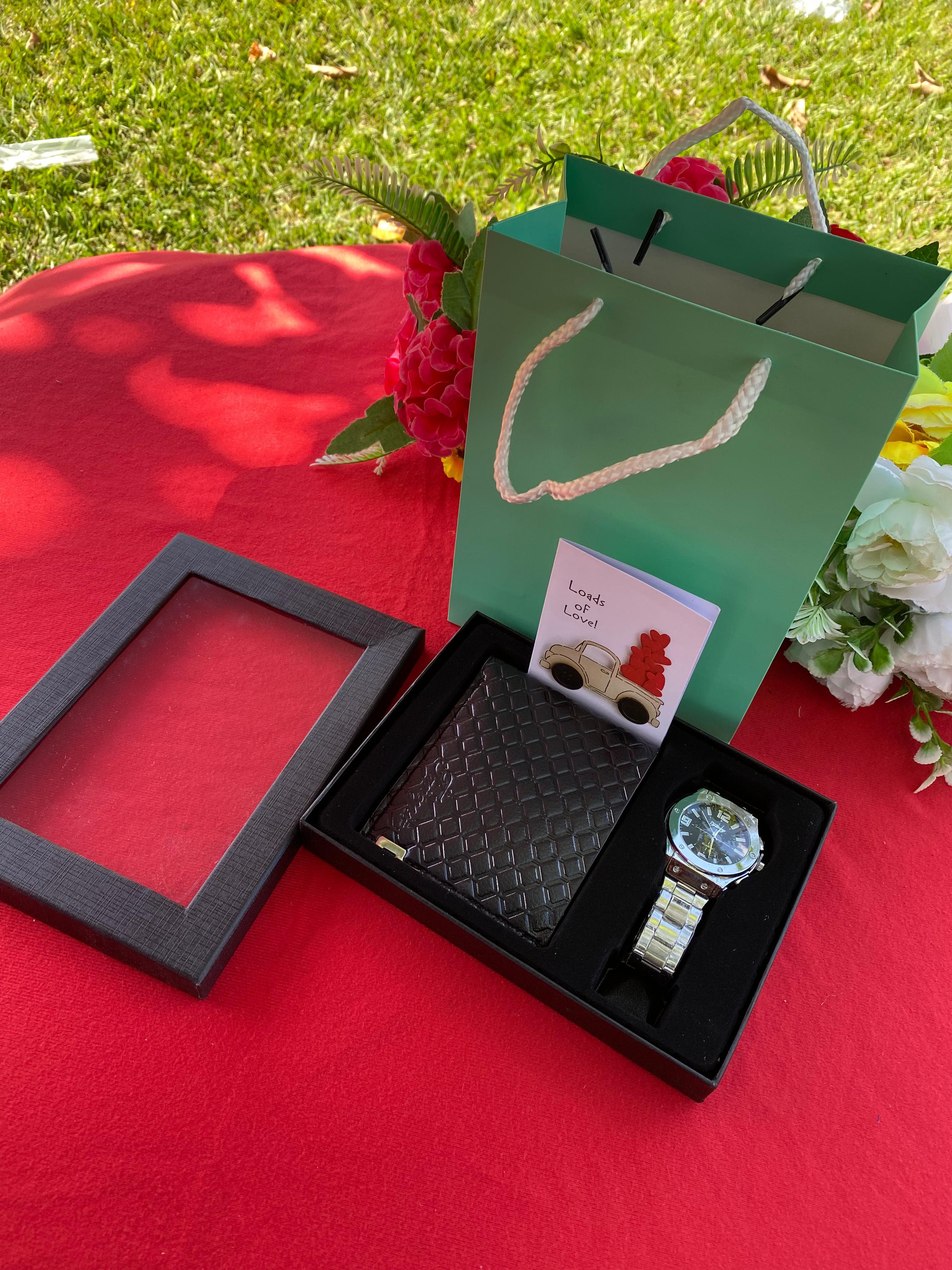 (NEW CLASSY ARRIVAL)Mens modest valentines gift set.Comprises of a watch a card a bag and a wallet.