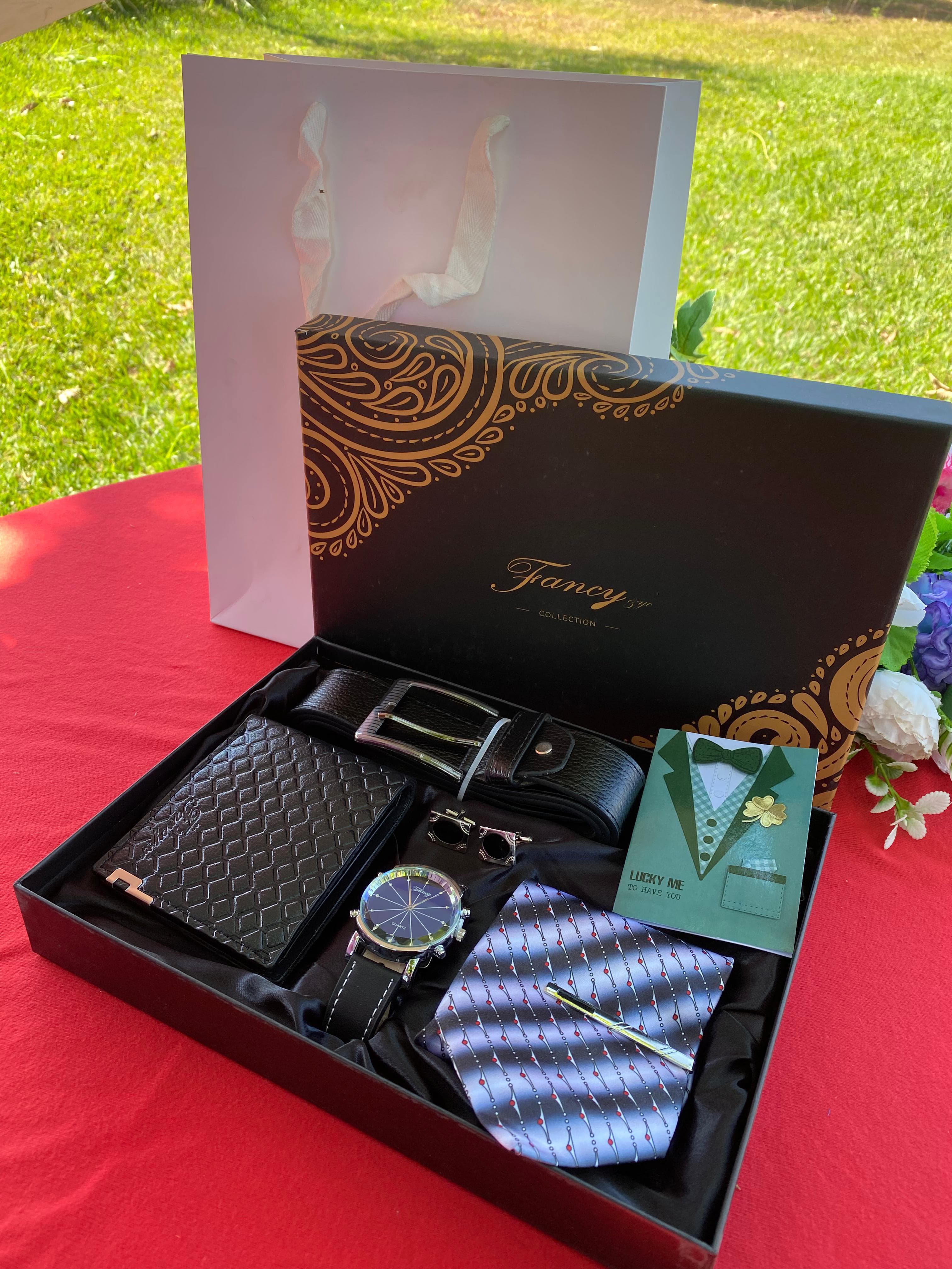 VALENTINES MEN GIFT PACK comprises of top notch quality to match a,Tie, Wallet,  Watch, Belt ,Shirt cufflinks, Gift card and a Box & Bag
