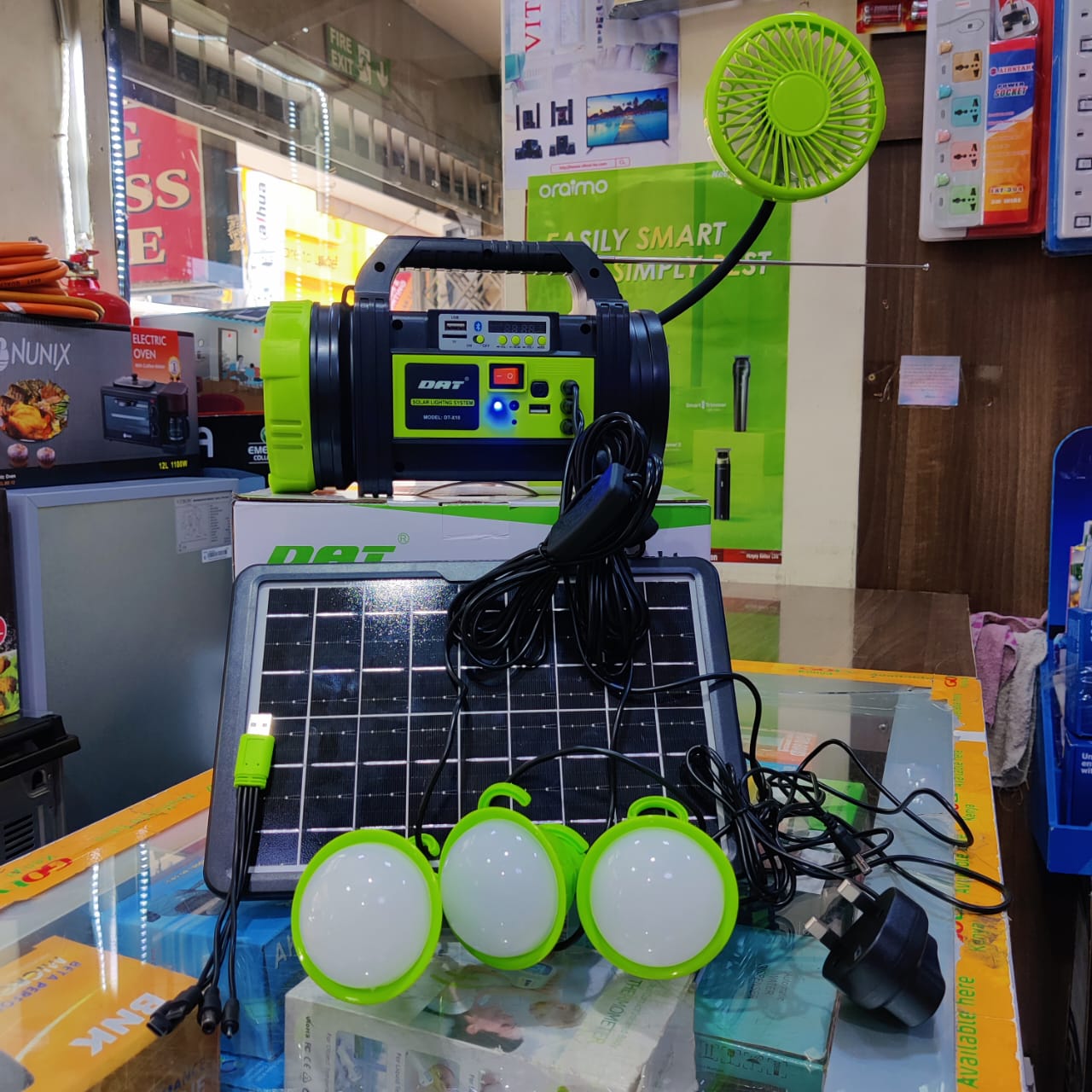 DAT HOME LIGHTING SYSTEM MODEL AT-X10: *Radio*Bluetooth, *Solar panel 8w (Mono)*3 bulbs*2 torches*Adaptor*Phone charger* Fan. Made of the modern technology to ensure durability,longetivityand convinie