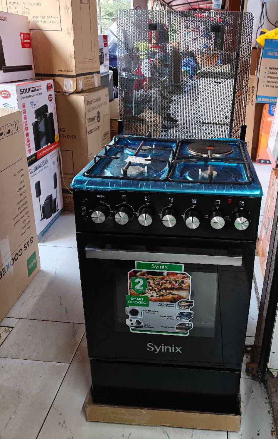 Syinix 50by 50 standing cooker with electric oven, Auto ignition, jet valves, rapid hotplate, oven grill/rotisserie fork.