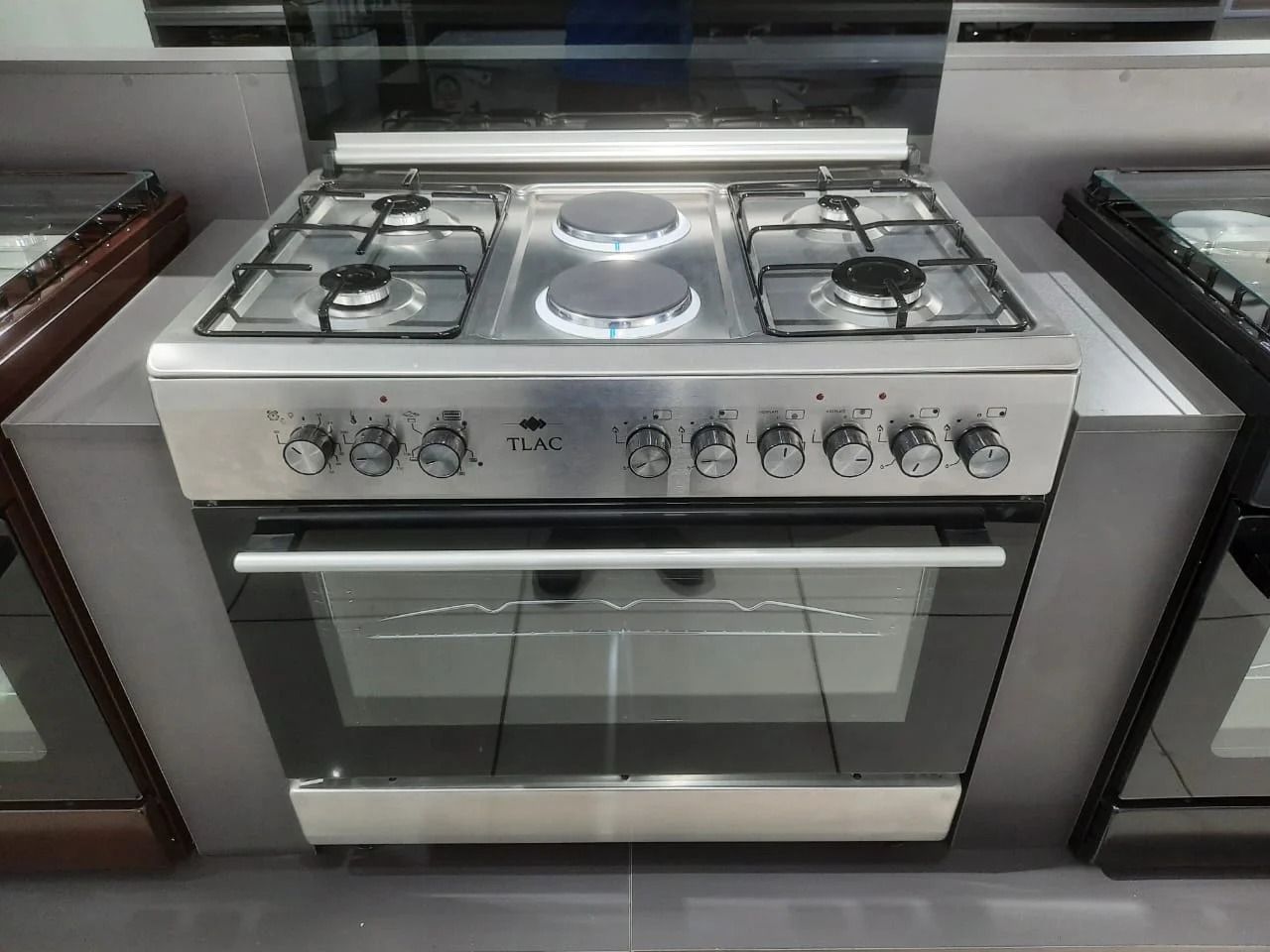 60*90 tlac 4+2 standing cooker with electric oven - Unbreakable Glass Top Lid,4 gas burners + 2 electric Rapid Hot plate,Heavy Duty Matt Finish Burner Caps,Mechanical timer,Electric oven and grill.