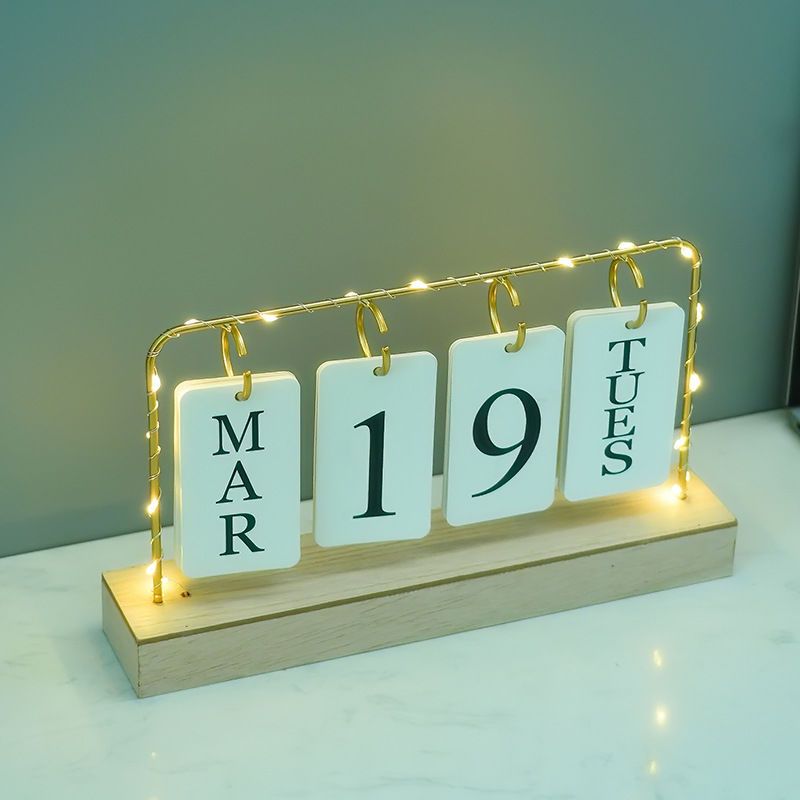 Metallic desktop home/office calendar with light...Uses 2 AA batteries to light[not included]