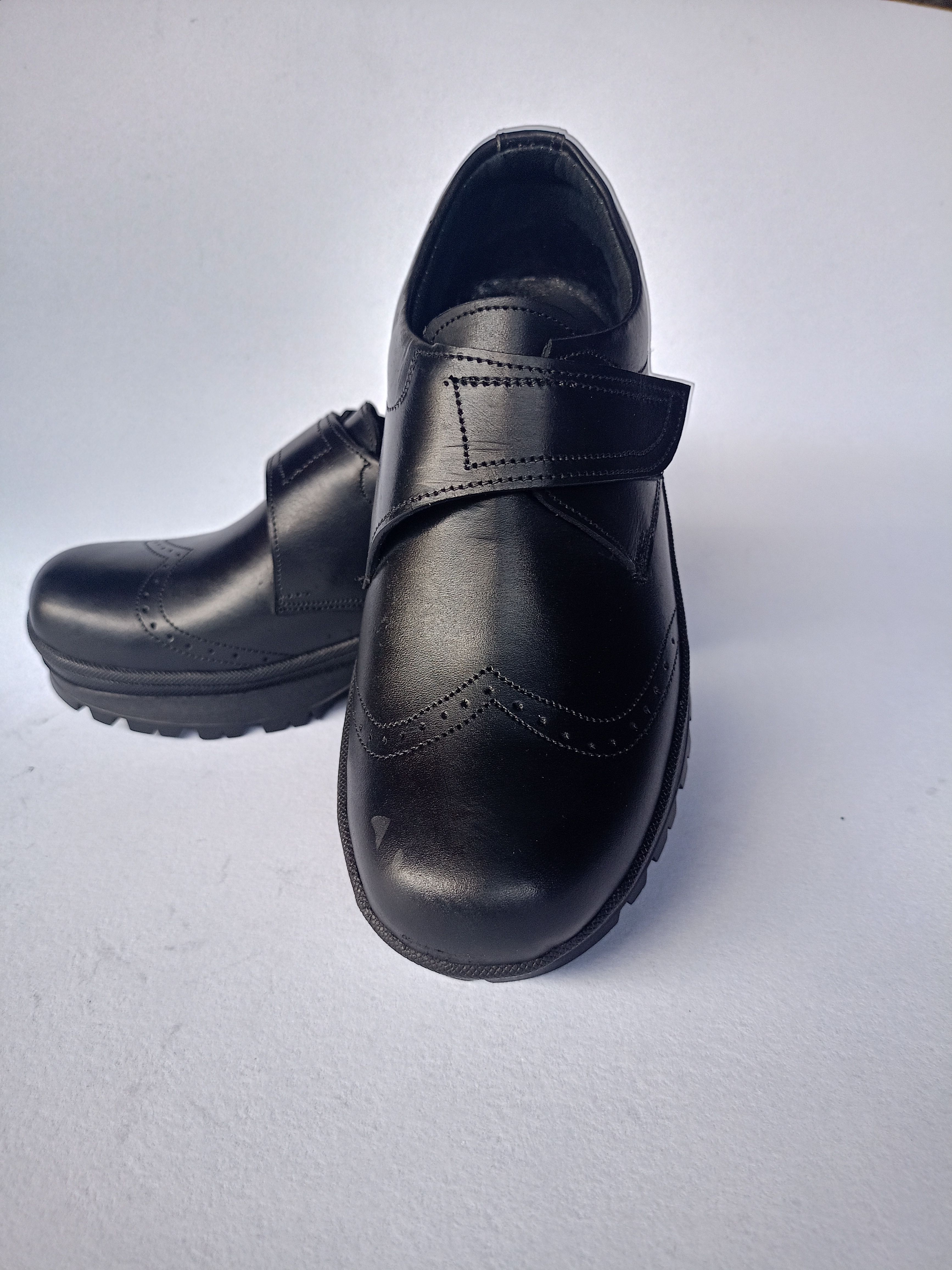 Back to School Kids Black Genuine Leather Shoes with New Design and Vecro Design for Closure,  For both Boys and Girls
Comfortable Durable and Long Lasting School Shoes available in all Sizes