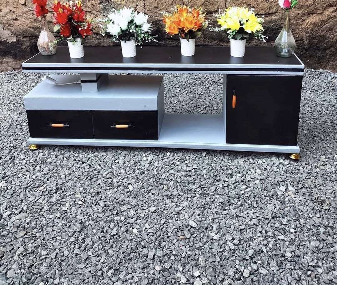 Sleek & Smart TV Stand – Fits up to 55" TVs

Elevate your living room with this modern TV stand designed to support up to 55-inch LED TVs. Featuring 3 spacious drawers for all your media essentials an