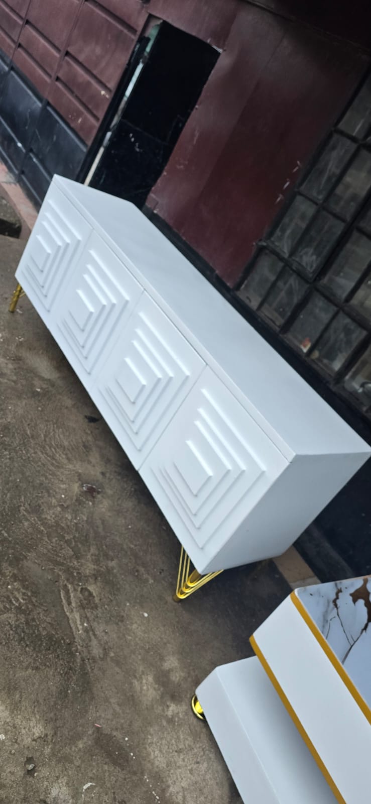 5FT TV stand or buffet cabinet. It is a piece of furniture designed to hold a television and other electronic devices, or to be used as a storage unit in a dining or living area.  one shown has a whit