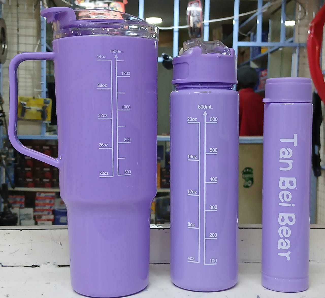 three water bottles. They are a "motivational water bottle set" with time markers to help track daily water intake. 
The set includes three bottles of different sizes: 2000ml, 800ml, and 300ml. 
The b