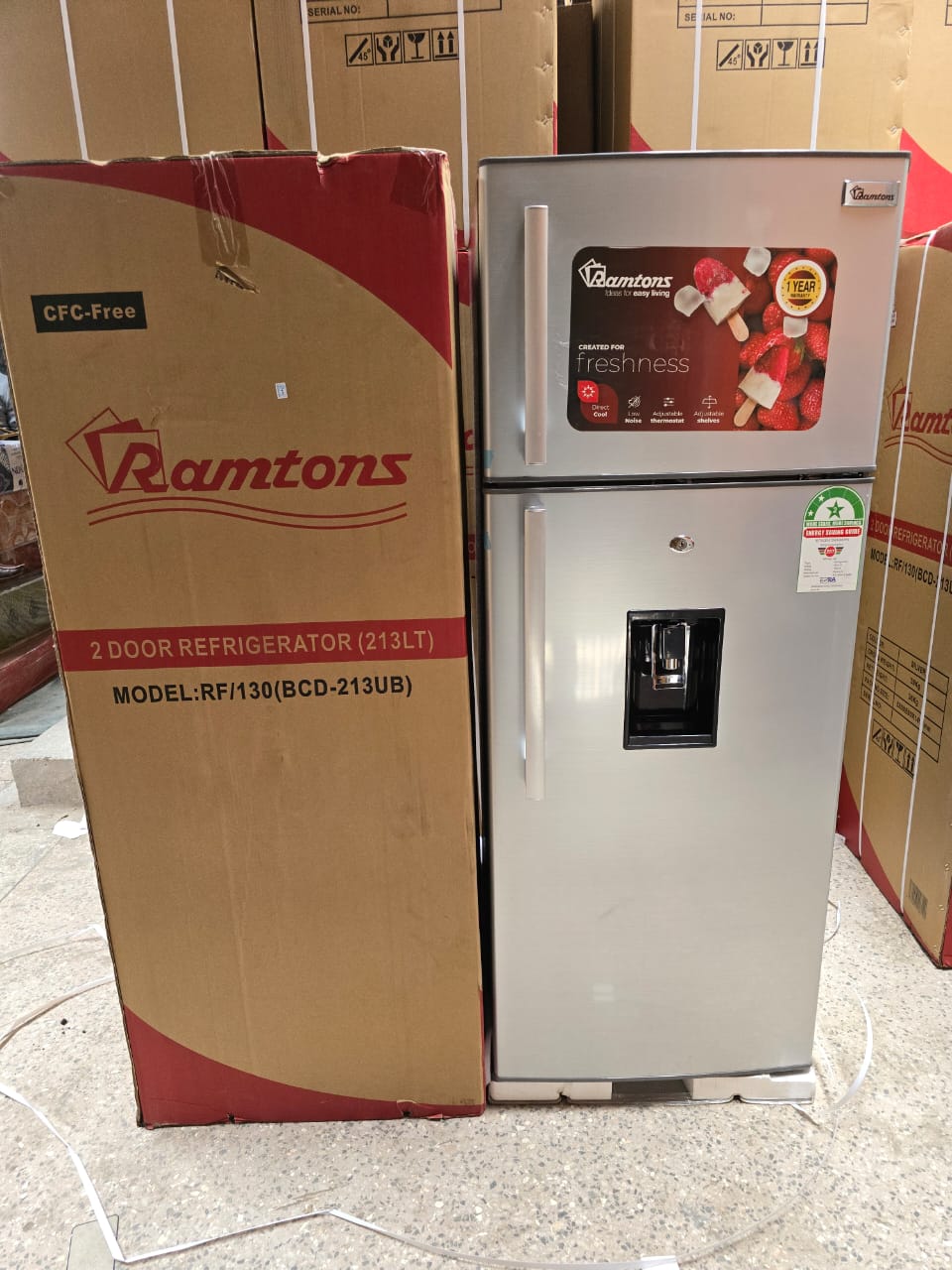 Ramtons RF/130-213L 2-Door Direct Cool Fridge with a built-in water dispenser.
Capacity: 213 Liters. 
Features: It is a double-door refrigerator with a top-mount freezer, a water dispenser, and adjust