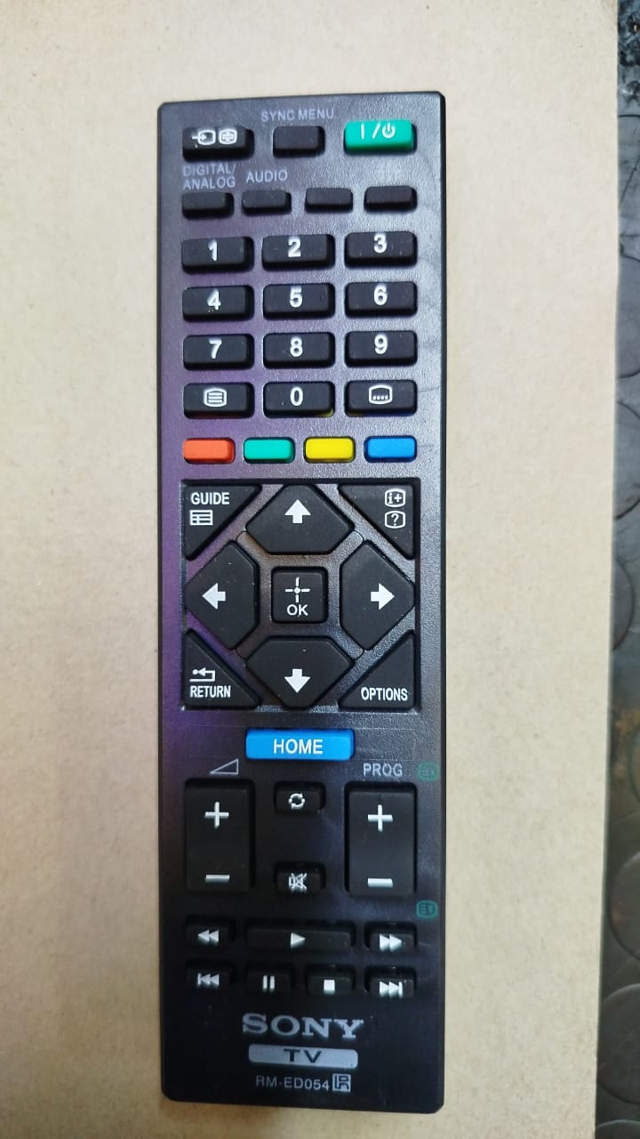 Sony RM-ED054 television remote control. 
Compatibility: Designed for Sony Bravia LCD and LED TV models. 
Functionality: Features dedicated menu navigation keys and direct access to digital TV channel