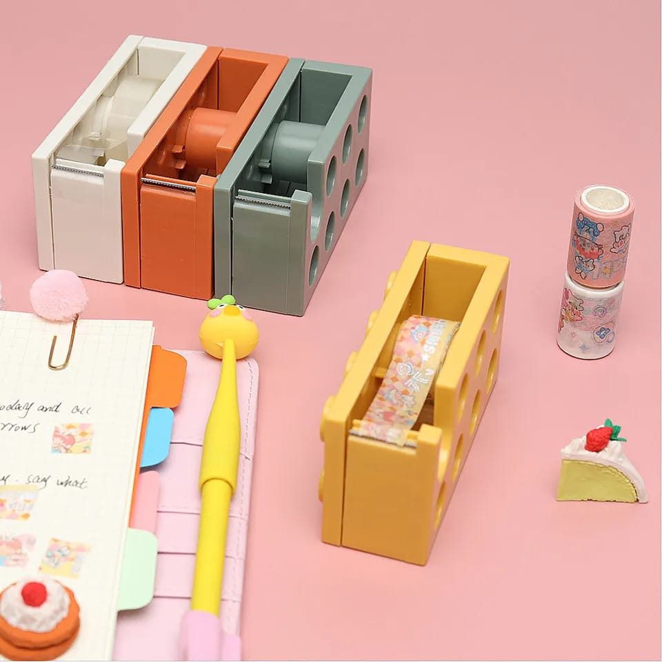 TAPE DISPENSER. Office tape dispenser, Highly durable, Strong stable base, Water proof, Easy to use, it can be used in all weather since it is made of plastic which is waterproof hence can not rust.