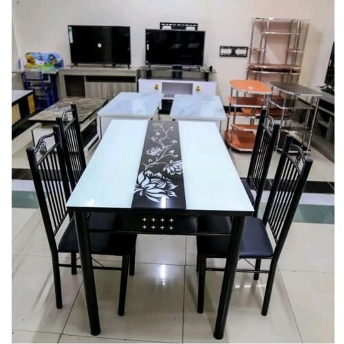 ELEGANT 4 SITTER DINNING TABLE - Dine in style with this splendid and rectangular shape elegant dinner table set, it comes with 4 sturdy chairs and is finely crafted from premium quality glass .