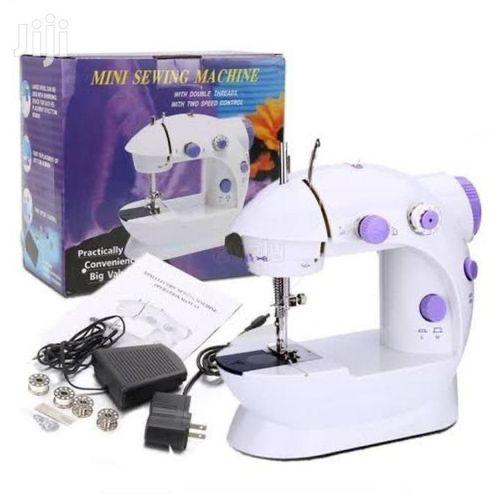 Mini Electric Sewing Machine.This is a mini lightweight, compact and portable sewing machine that features double thread, double speed, No reverse button. Perfect for little projects or teaching kids